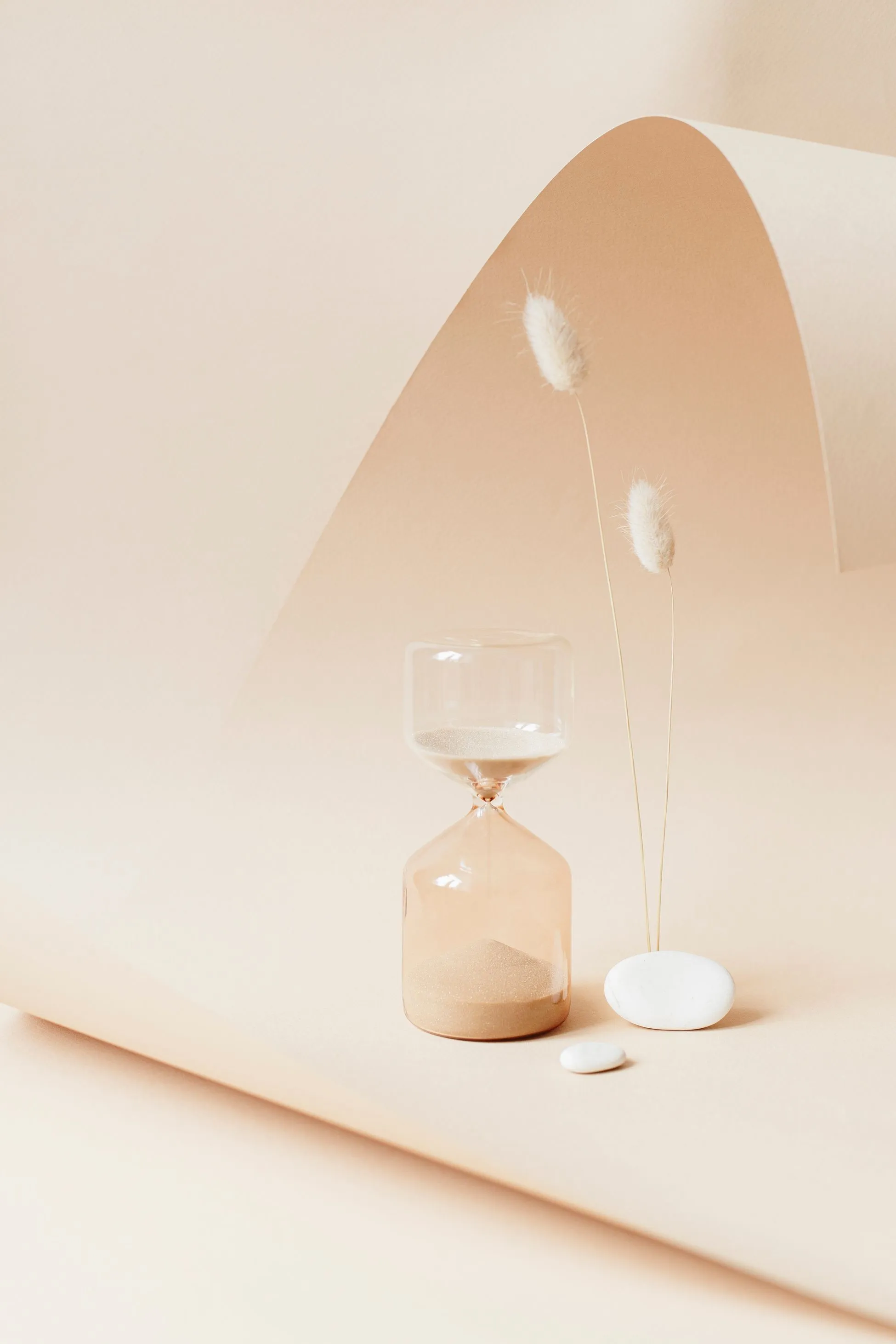 hourglass and wheat stalks